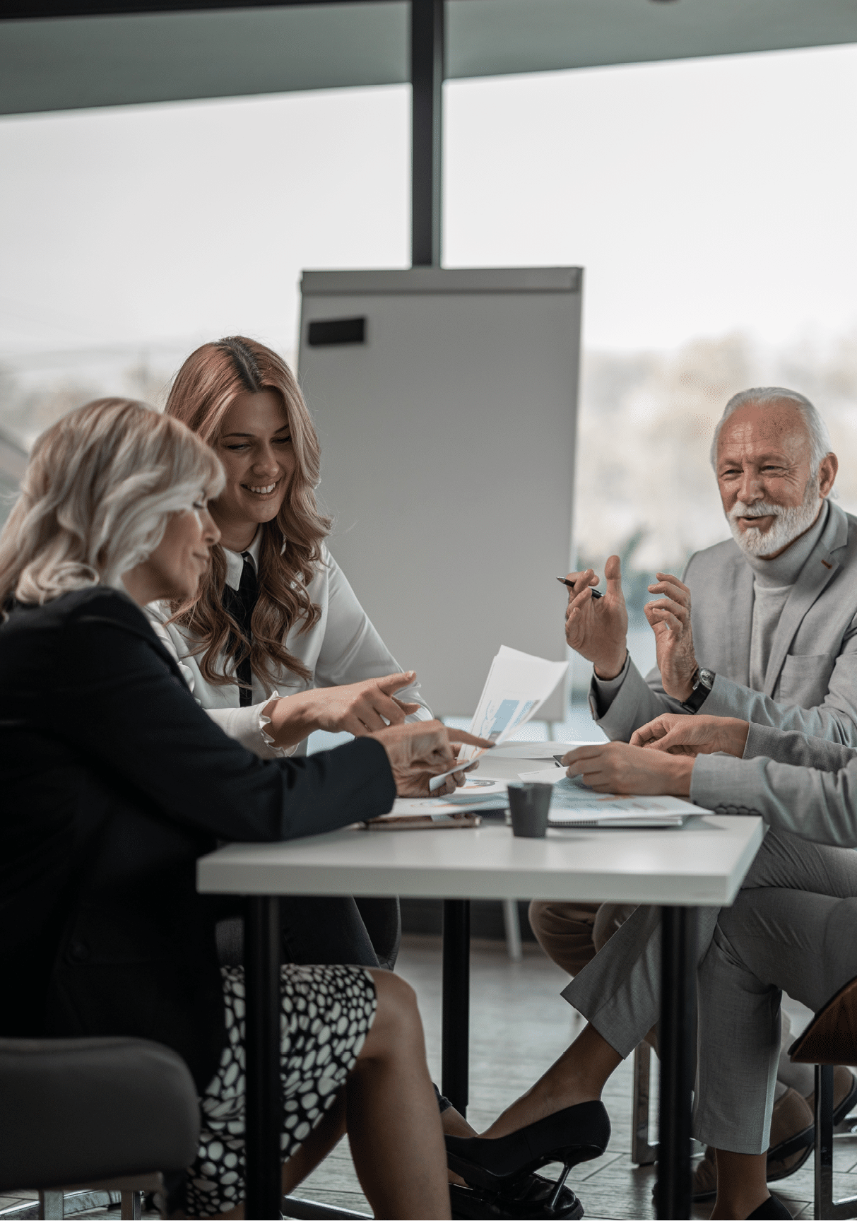Group of business people on meeting, discussing with some chart examples